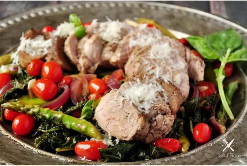 Pork over Warm Kale and Asparagus Salad