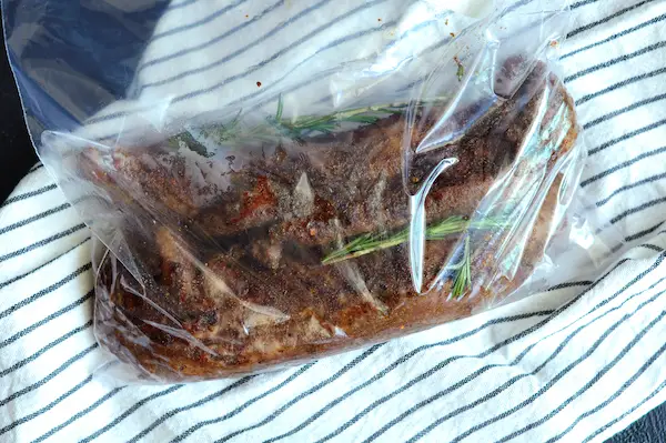 Place seared pork in a Ziploc bag, add the rosemary if using. 