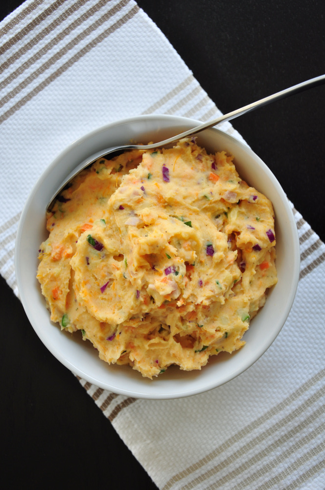 Make mashed potato salad healthier and more flavorful by adding a variety of fresh and crunchy vegetables. This recipe is gluten-free.