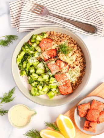 Whip up a healthy Salmon Quinoa Bowl in 30 minutes or faster with sous vide meal prep. This gluten-free, dairy-free recipe features honey-paprika salmon, a fresh cucumber salad, and a zesty sauce, all coming together to create a perfectly balanced meal.