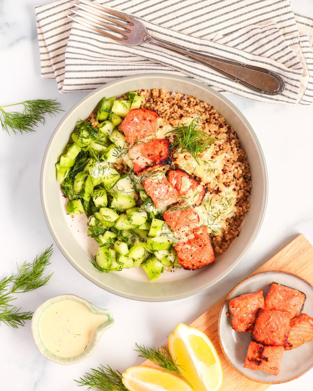 Whip up a healthy Salmon Quinoa Bowl in 30 minutes or faster with sous vide meal prep. This gluten-free, dairy-free recipe features honey-paprika salmon, a fresh cucumber salad, and a zesty sauce, all coming together to create a perfectly balanced meal.