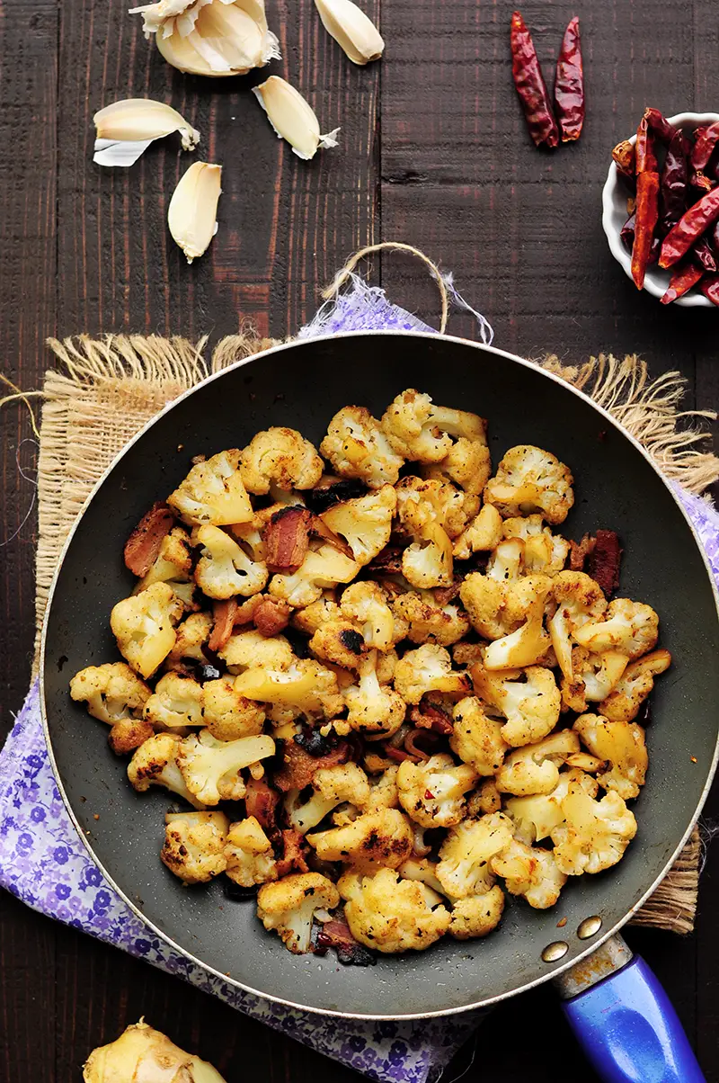 An easy recipe with only 7 ingredients like this sautéed cauliflower with bacon is perfect for any busy workday dinner. It’s a little spicy, gluten-free and so delicious that you won’t want to stop digging in.