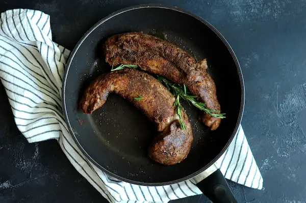 Heat a non-stick skillet or cast-iron skillet over high heat until really hot, add olive oil, and immediately sear the seasoned pork, 30 seconds on each side. Remove from heat.