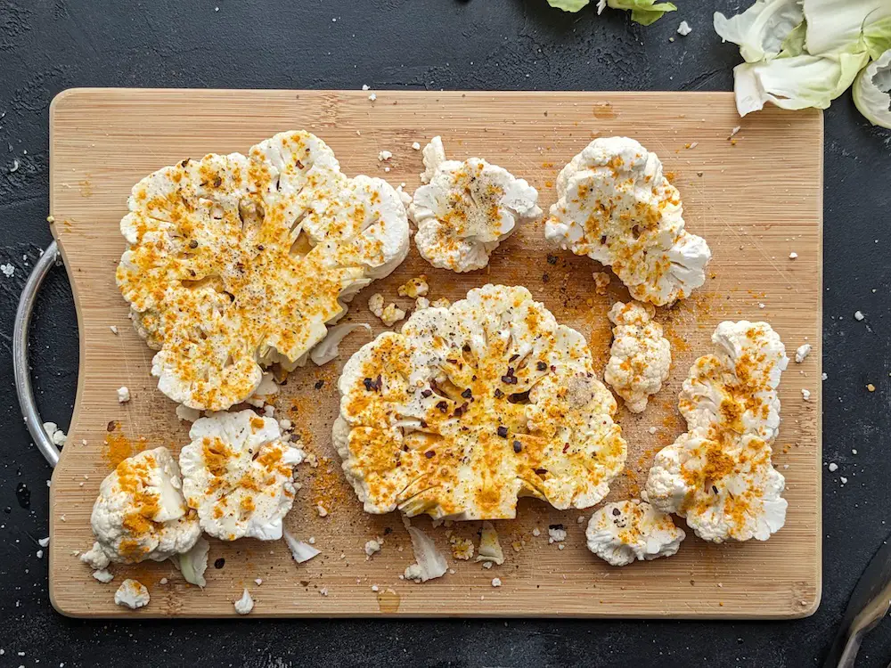 Season cauliflower steaks