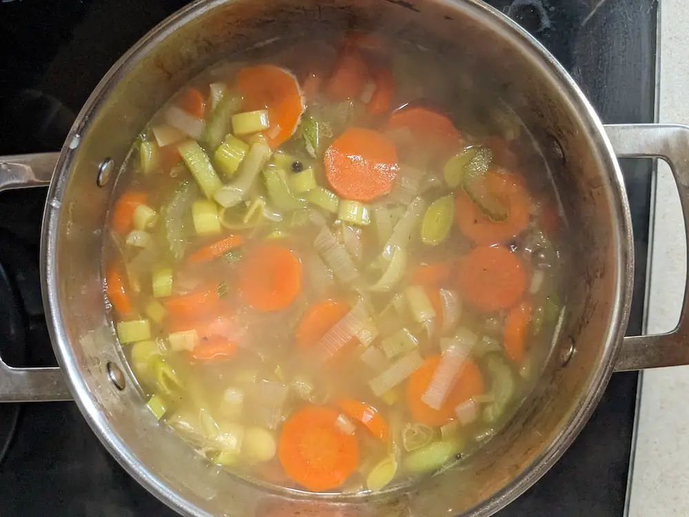 Simmering the chicken leek soup