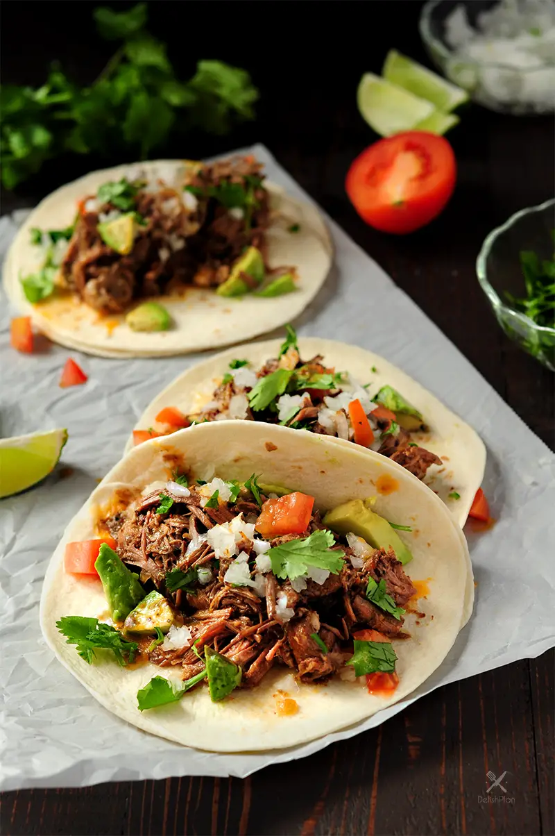 Extremely tender beef barbacoa slow-cooked in a super savory sauce. This recipe only takes 5 mins of hands-on time. Enjoy barbacoa tacos anytime!