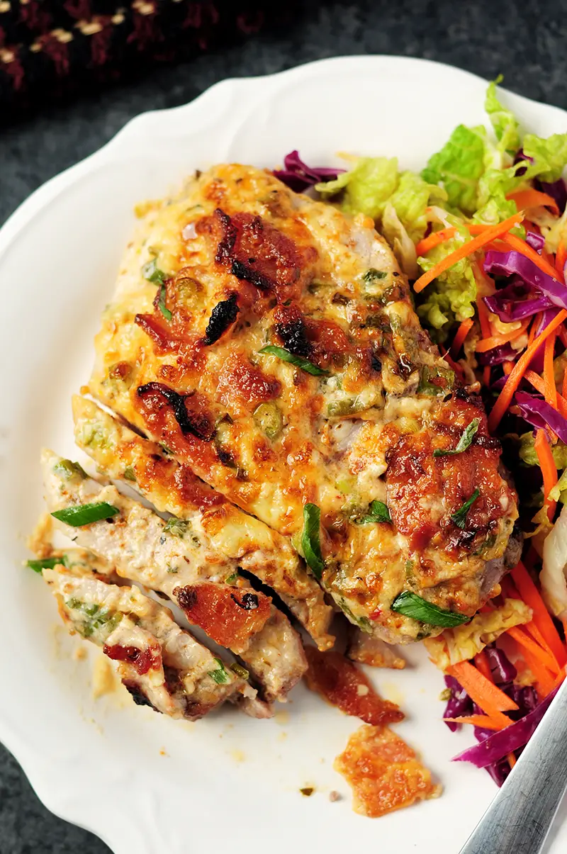 Baked pork chops covered in a smoky bacon and cheese mixture, with a simple vegetable slaw, you can wrap up this gluten-free and low-carb meal in 2