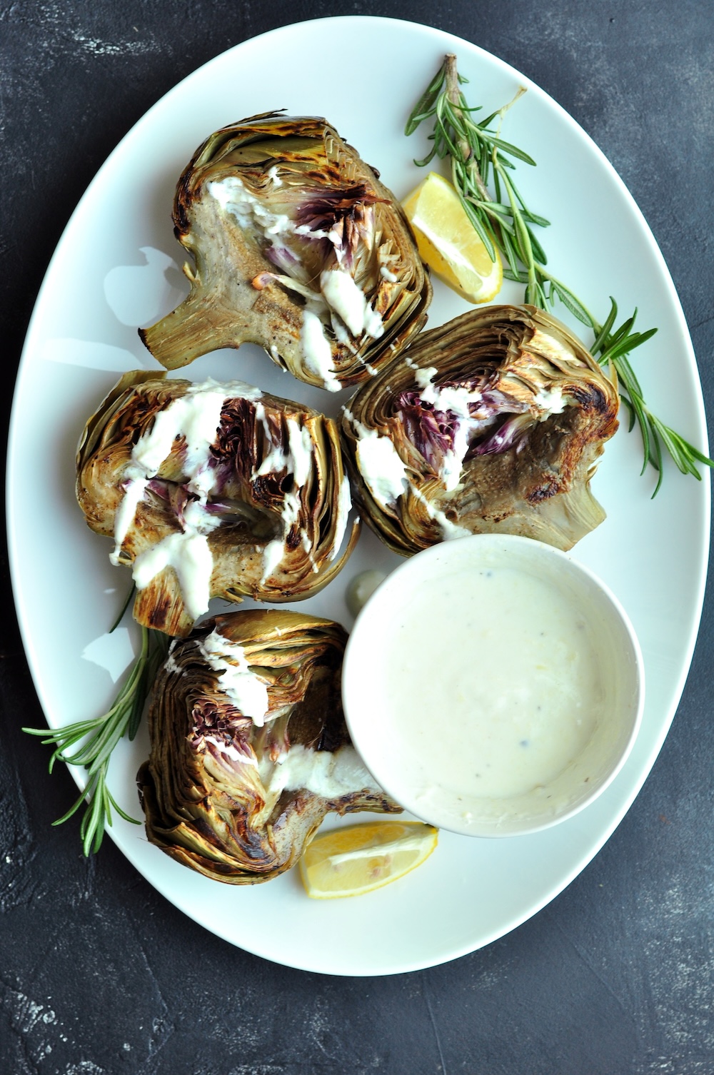 These beautifully tender sous vide artichokes are a versatile choice as either a sophisticated appetizer or a refined side dish for your main courses. Serve them with a homemade yogurt dipping sauce—its creaminess and hint of zest complement the subtle, earthy flavor of the artichokes exquisitely.