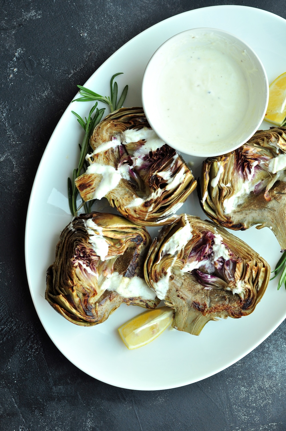 These beautifully tender sous vide artichokes are a versatile choice as either a sophisticated appetizer or a refined side dish for your main courses. Serve them with a homemade yogurt dipping sauce—its creaminess and hint of zest complement the subtle, earthy flavor of the artichokes exquisitely.