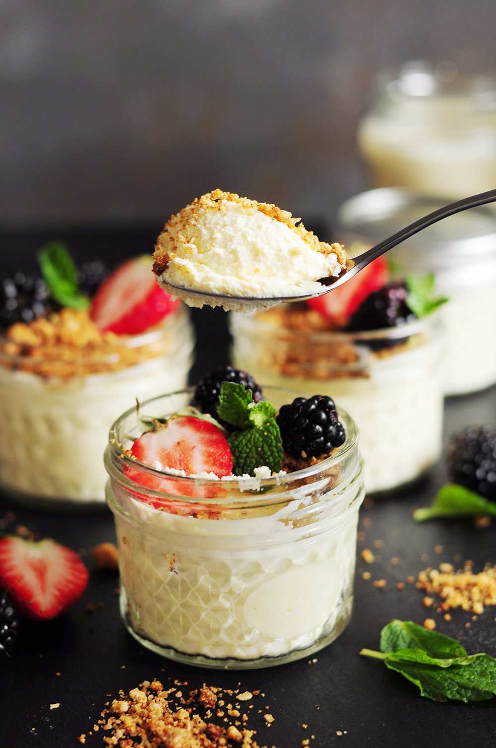 A spoonful of sous vide cheesecake from a jar