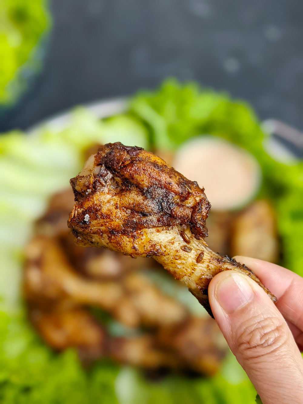 Holding one of the sous vide chicken wings