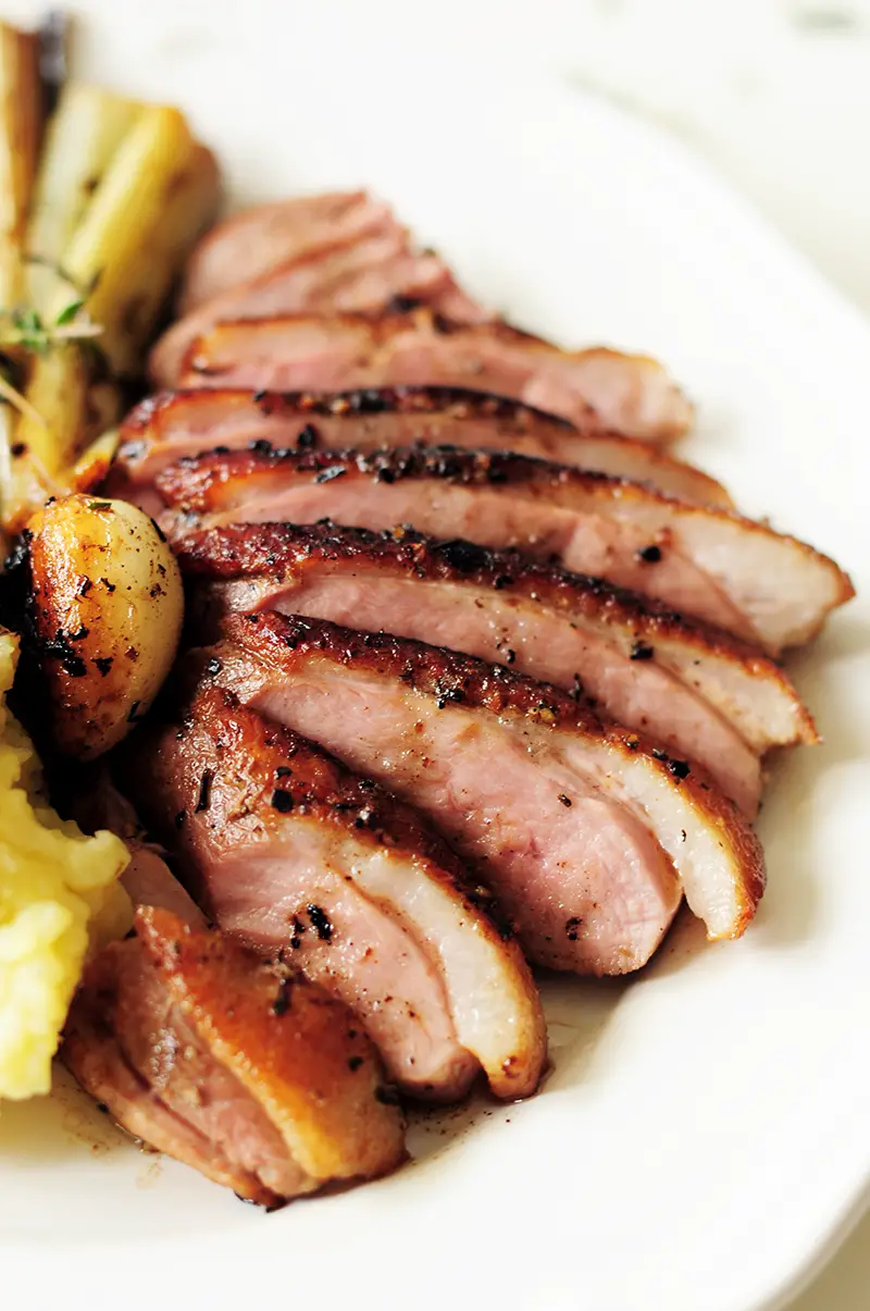 Juicy sous vide duck breast served with fluffy garlic mashed potatoes and braised leeks simmered in a white wine sauce. This date-night dinner is on point!