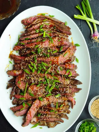 Sous vide flank steak marinated and glazed with a gluten-free Mongolian sauce! Learn how to make this scrumptious recipe with just seven ingredients.