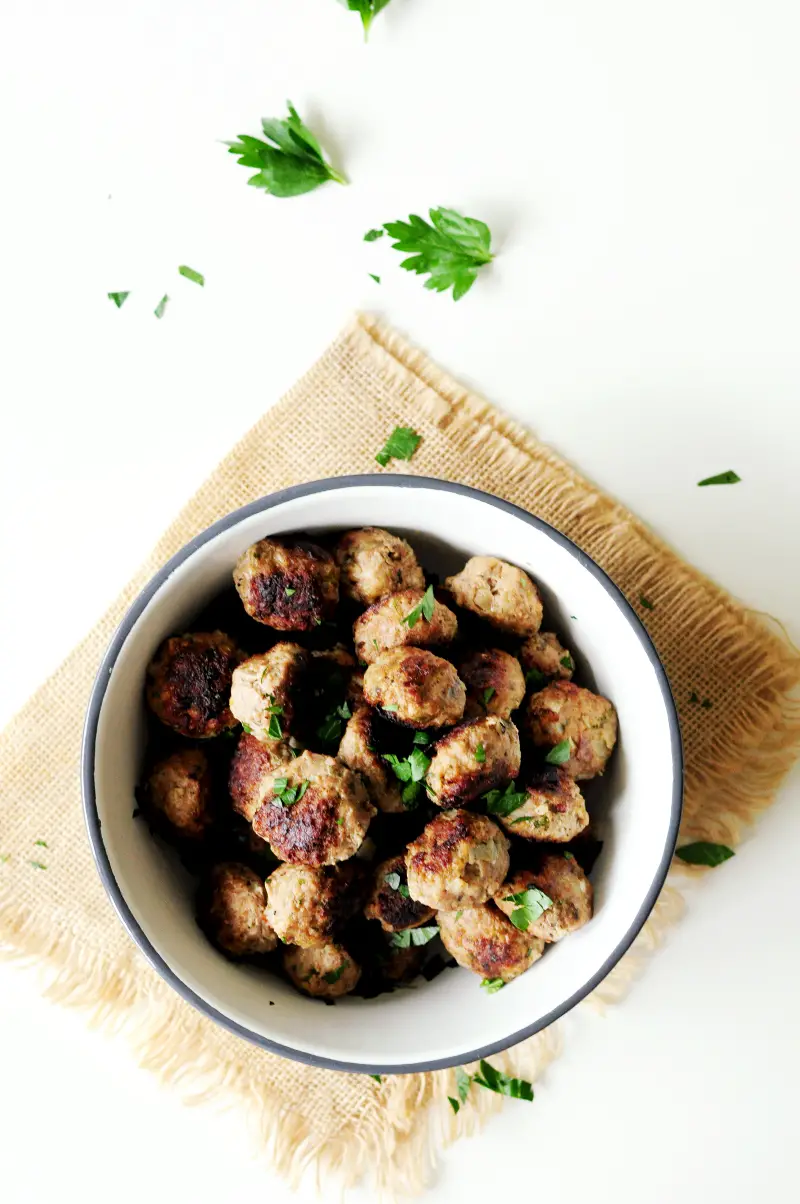 Topped with pasta sauce and parmesan cheese, these hearty, savory sous vide meatballs will satisfy your comfort food cravings any day of the week.