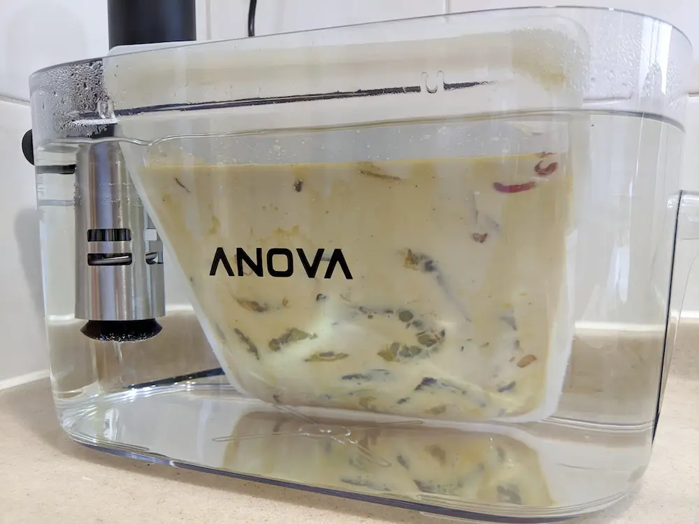 Use the water displacement method to submerge the shrimp under the sous vide water bath.