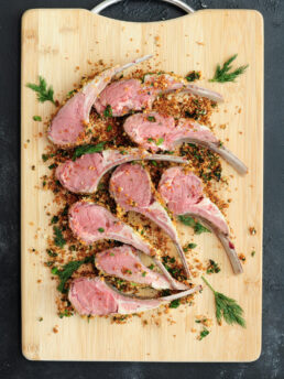 Sous vide rack of lamb coated with a crust of fresh green herbs and freshly grated parmesan cheese. It's perfect for a special occasion.