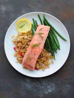 Sous vide salmon with green beans and dirty rice