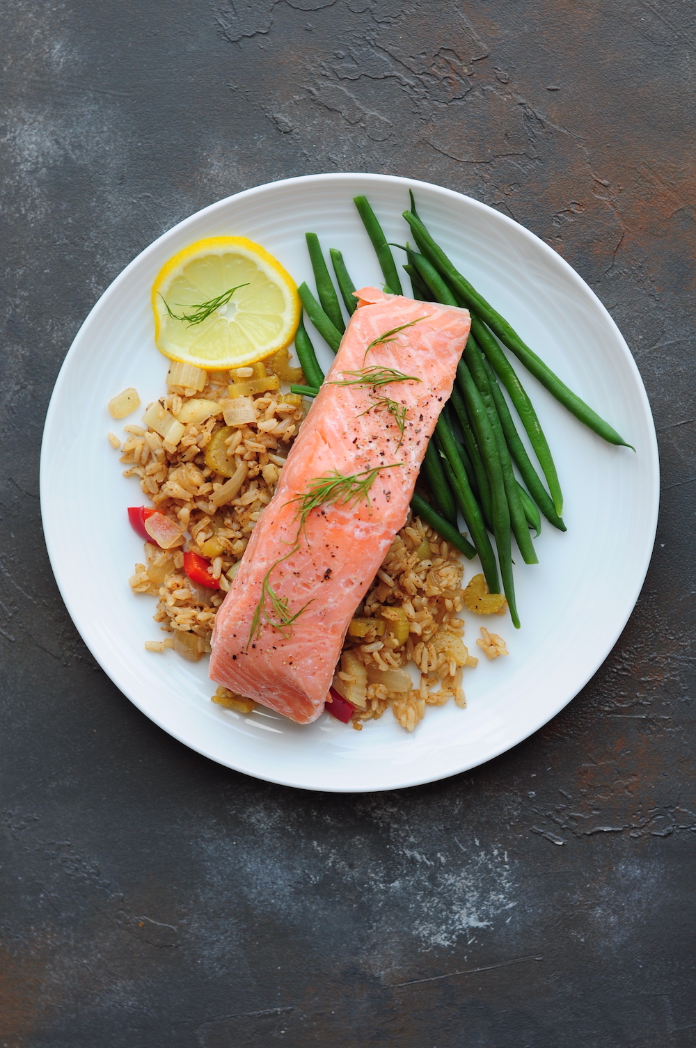 Sous vide salmon with green beans and dirty rice