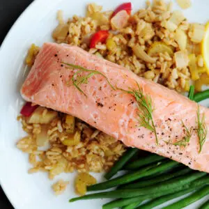 Sous vide salmon with green beans and dirty rice