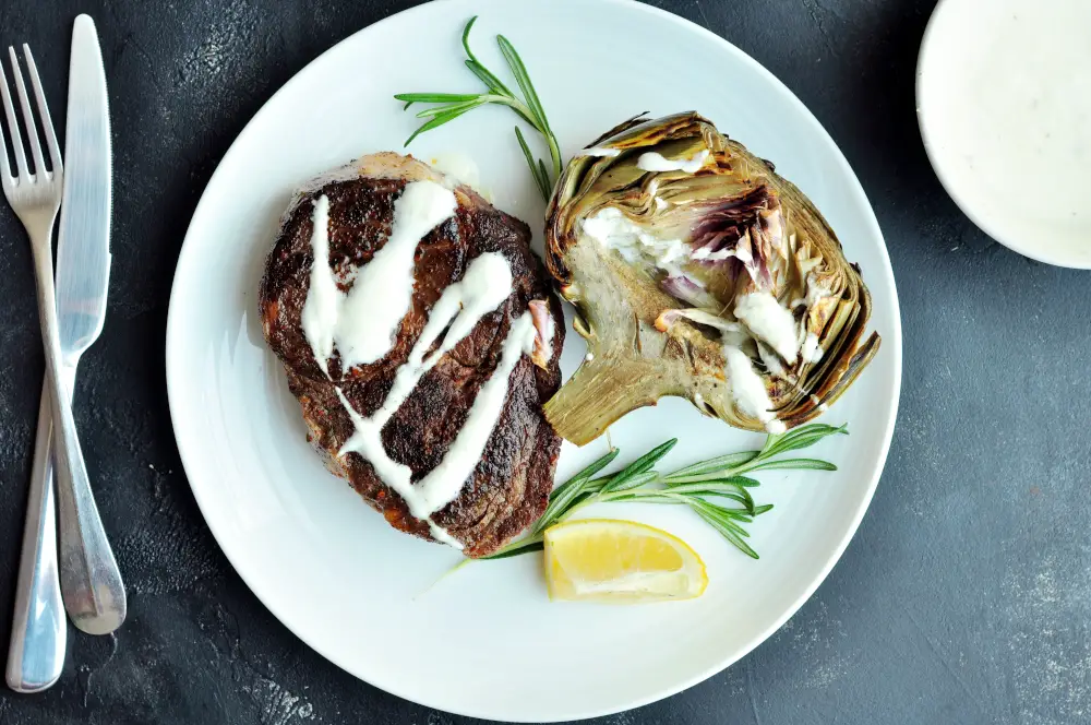 Sous vide steak with sous vide artichokes and homemade yogurt sauce