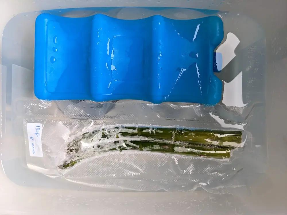 Sous vide asparagus in an ice-water bath