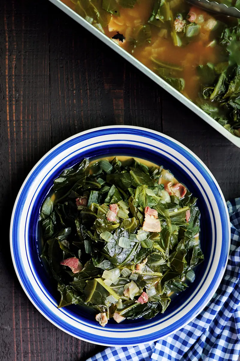 Easy and nutritious southern collard greens with bacon and bone broth slow cooked in the oven or on the stove. 