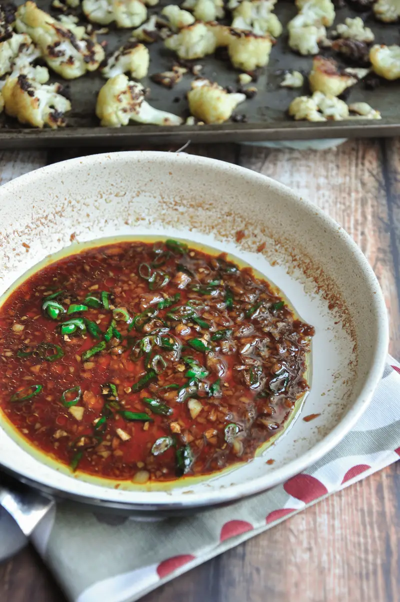 Say goodbye to bland and boring cauliflower. This roasted Asian cauliflower with a soy-ginger sauce is healthy, hearty, and a vegan crowd-pleaser. 