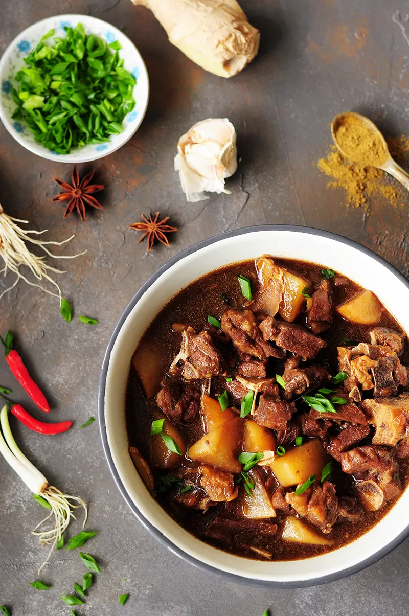 Winter comfort food done right: This spicy, Asian-inspired lamb stew is flavored with Asian sauces, Thai chilis, star anise to warm you up from the inside.
