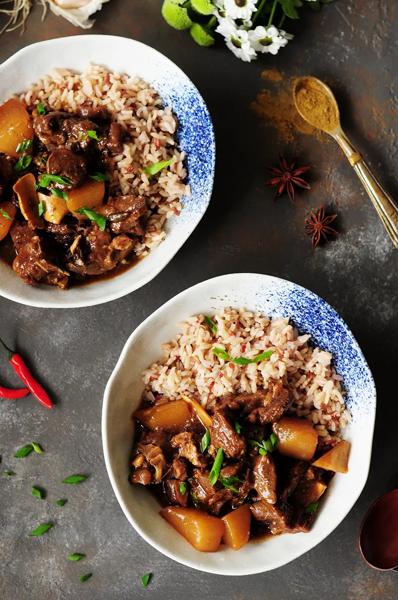 Winter comfort food done right: This spicy, Asian-inspired lamb stew is flavored with Asian sauces, Thai chilis, star anise to warm you up from the inside.