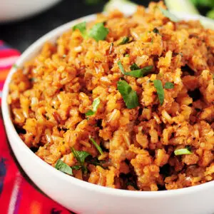 A detailed step-by-step guide on how to make Mexican rice that's authentic, healthy, and addictive every single time. Recipe included.