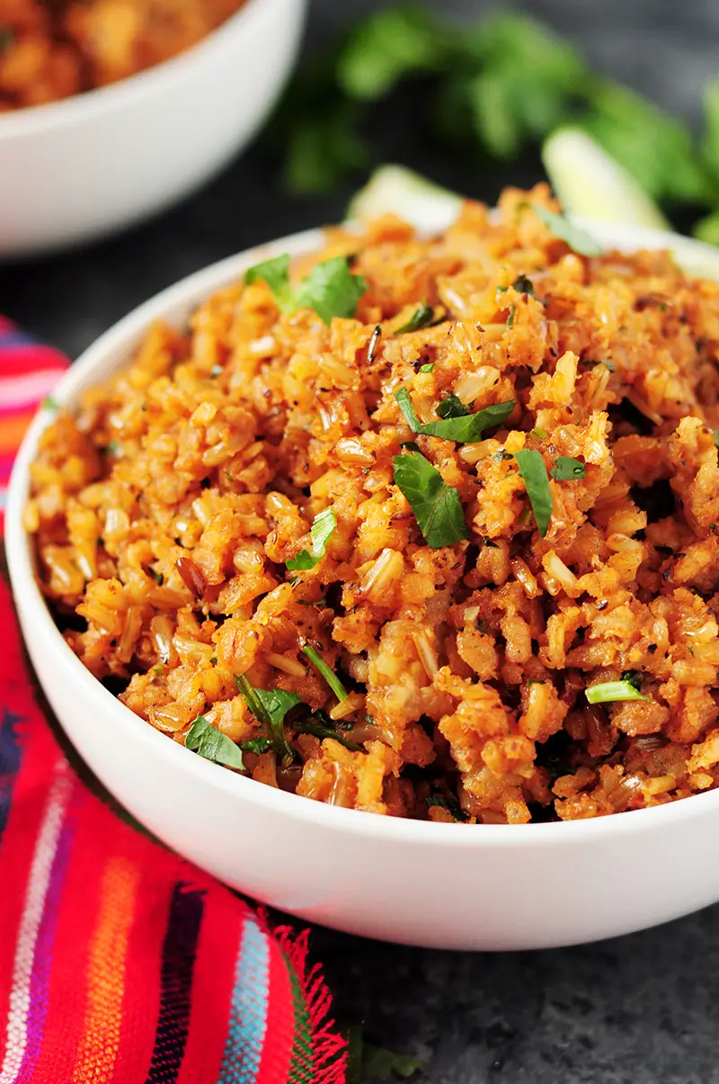 A detailed step-by-step guide on how to make Mexican rice that's authentic, healthy, and addictive every single time. Recipe included.