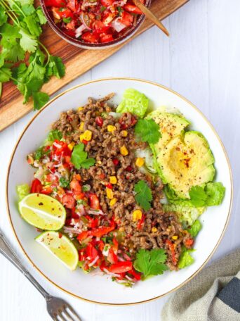 This ground beef taco salad bowl with refreshing pico de gallo is a 30-minute, high-protein meal packed with flavor. It's great for busy weeknights.