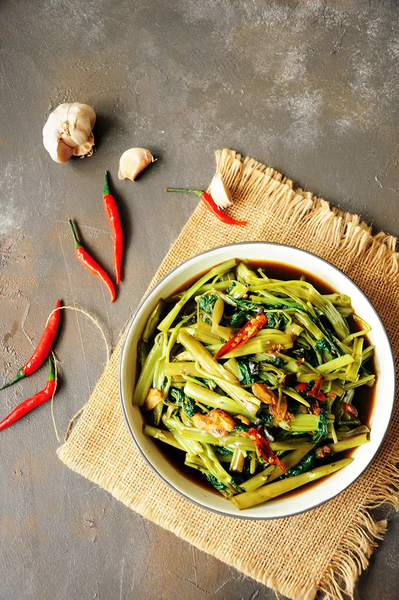 Cook one of the most popular Thai dishes at home with this tasty stir-fry morning glory (water spinach recipe.) It’s super quick and vegan-friendly.