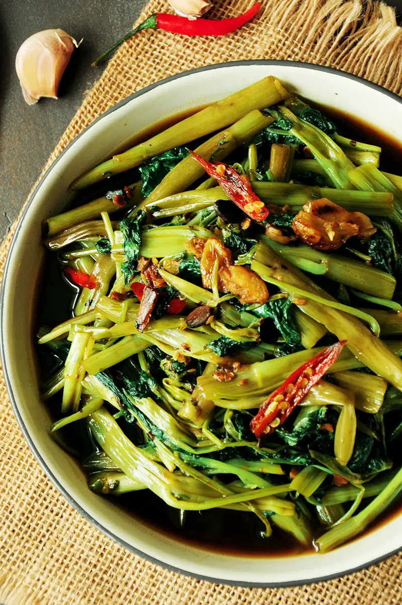 Cook one of the most popular Thai dishes at home with this tasty stir-fry morning glory (water spinach recipe.) It’s super quick and vegan-friendly.
