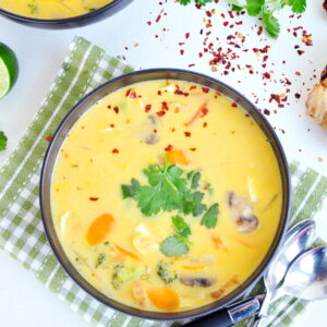 A light Thai vegetable soup recipe, flavored with authentic herbs along with hearty vegetables, coconut milk, and tofu. It's vegan and gluten-free friendly.