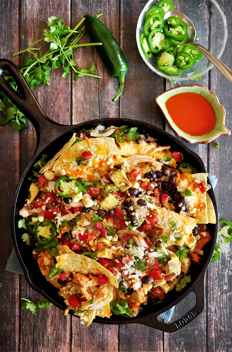 The best gooey, tangy, spicy buffalo chicken nachos you’ve ever had. Loaded with three types of cheese and fresh, Mexican-style ingredients. Ready in 20 minutes.