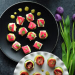 Tuna-cucumber stackers and sausage-zucchini stackers with the same sauce and cheese to please both seafood lovers and meat lovers in your family.