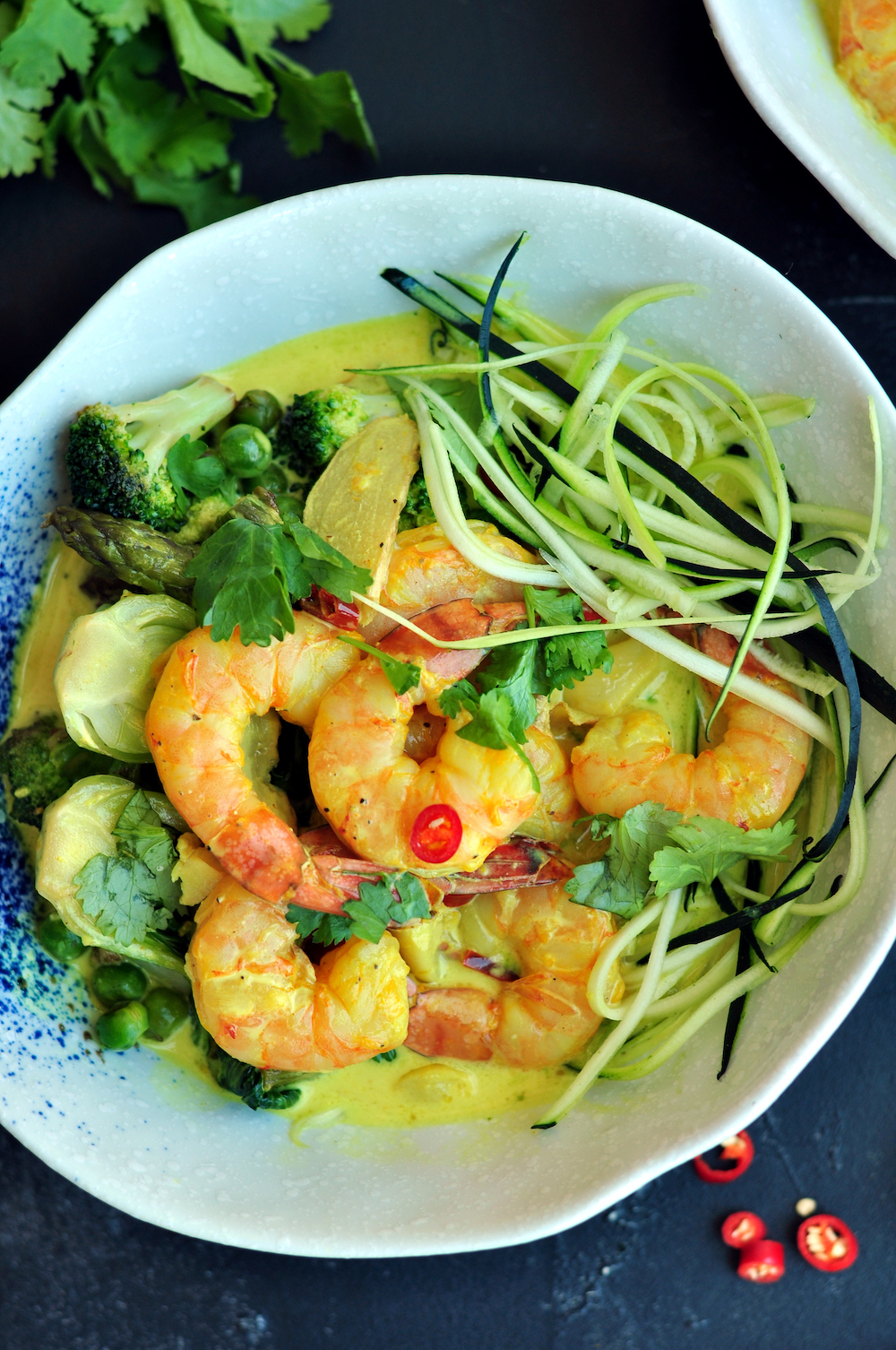 Turmeric Sous Vide Shrimp Poached in Cocconut Milk Served over Zoodles