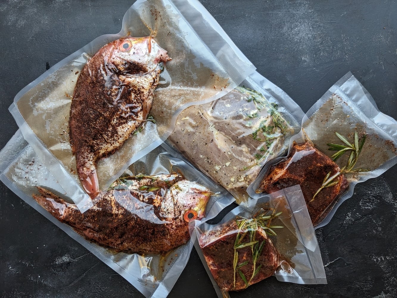 Bag them separately. Each protein gets its own vacuum-sealed bag, even though they're going in the same water. They're different proteins meant for different meals, so keeping them in separate bags means each one comes out ready to go straight into whatever you're building with it that day—which is the whole point of meal prepping.