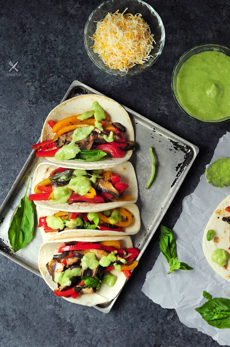 20-minute vegetarian tacos with bell peppers and portobello mushrooms cooked in a savory citrus sauce. It's a great meatless meal for your weekly meal plan.