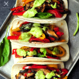 20-minute vegetarian tacos with bell peppers and portobello mushrooms cooked in a savory citrus sauce. It's a great meatless meal for your weekly meal plan.