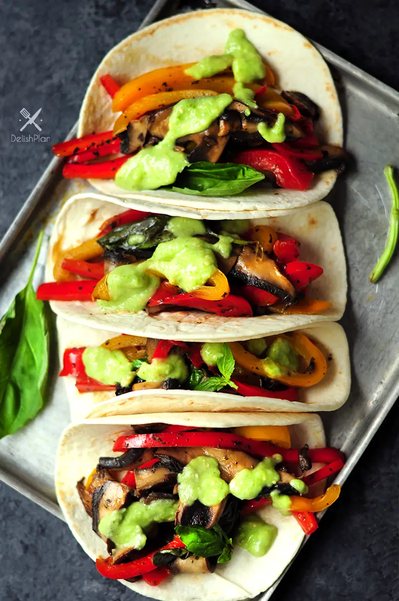 20-minute vegetarian tacos with bell peppers and portobello mushrooms cooked in a savory citrus sauce. It's a great meatless meal for your weekly meal plan.