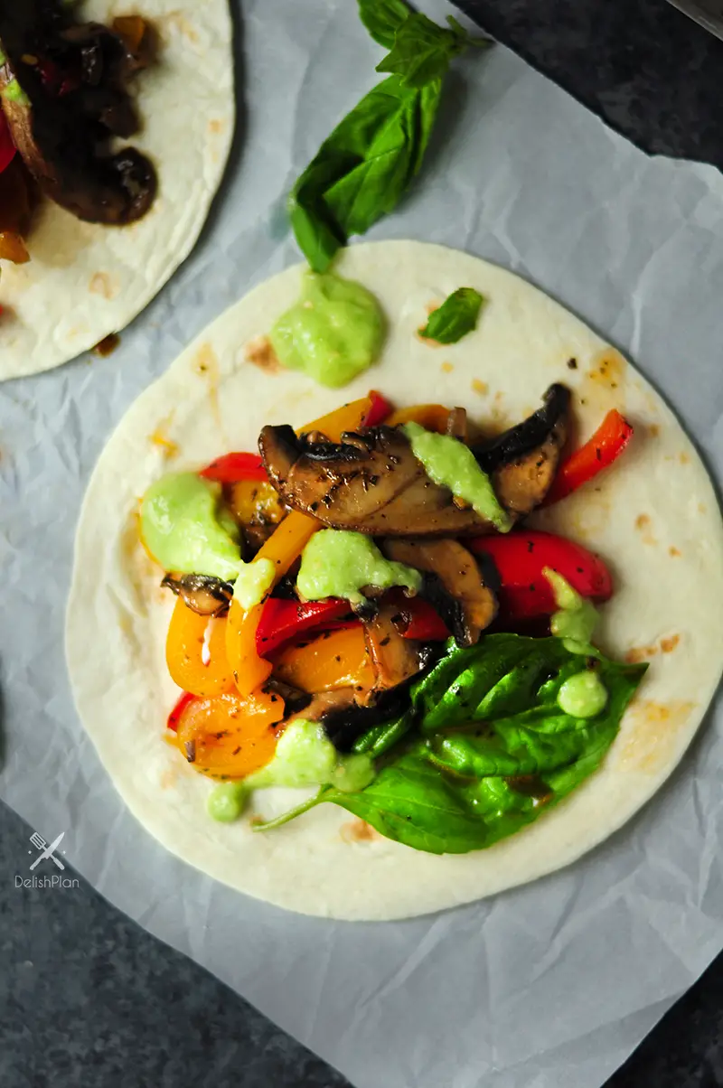 20-minute vegetarian tacos with bell peppers and portobello mushrooms cooked in a savory citrus sauce. It's a great meatless meal for your weekly meal plan.