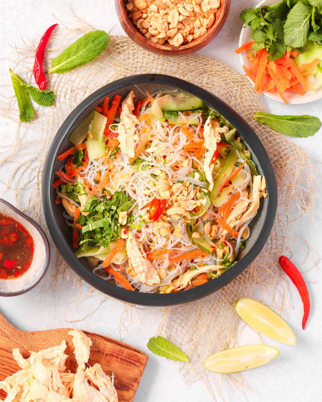 Enjoy a vibrant Vietnamese Chicken Noodle Salad ready in 15 minutes! This high-protein meal features sous vide chicken, fresh herbs, and zesty Nuoc Cham dressing for a quick, healthy lunch.