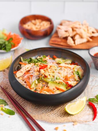 Enjoy a vibrant Vietnamese Chicken Noodle Salad ready in 15 minutes! This high-protein meal features sous vide chicken, fresh herbs, and zesty Nuoc Cham dressing for a quick, healthy lunch.