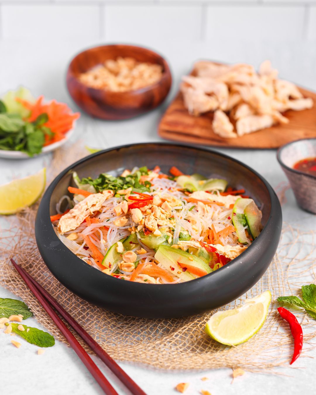 Enjoy a vibrant Vietnamese Chicken Noodle Salad ready in 15 minutes! This high-protein meal features sous vide chicken, fresh herbs, and zesty Nuoc Cham dressing for a quick, healthy lunch.