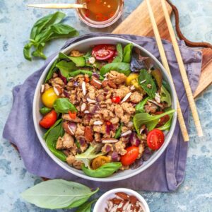 A bright, 25-minute Zesty Chicken Larb Salad with lime-fish sauce dressing, fresh herbs, and toasted almonds.