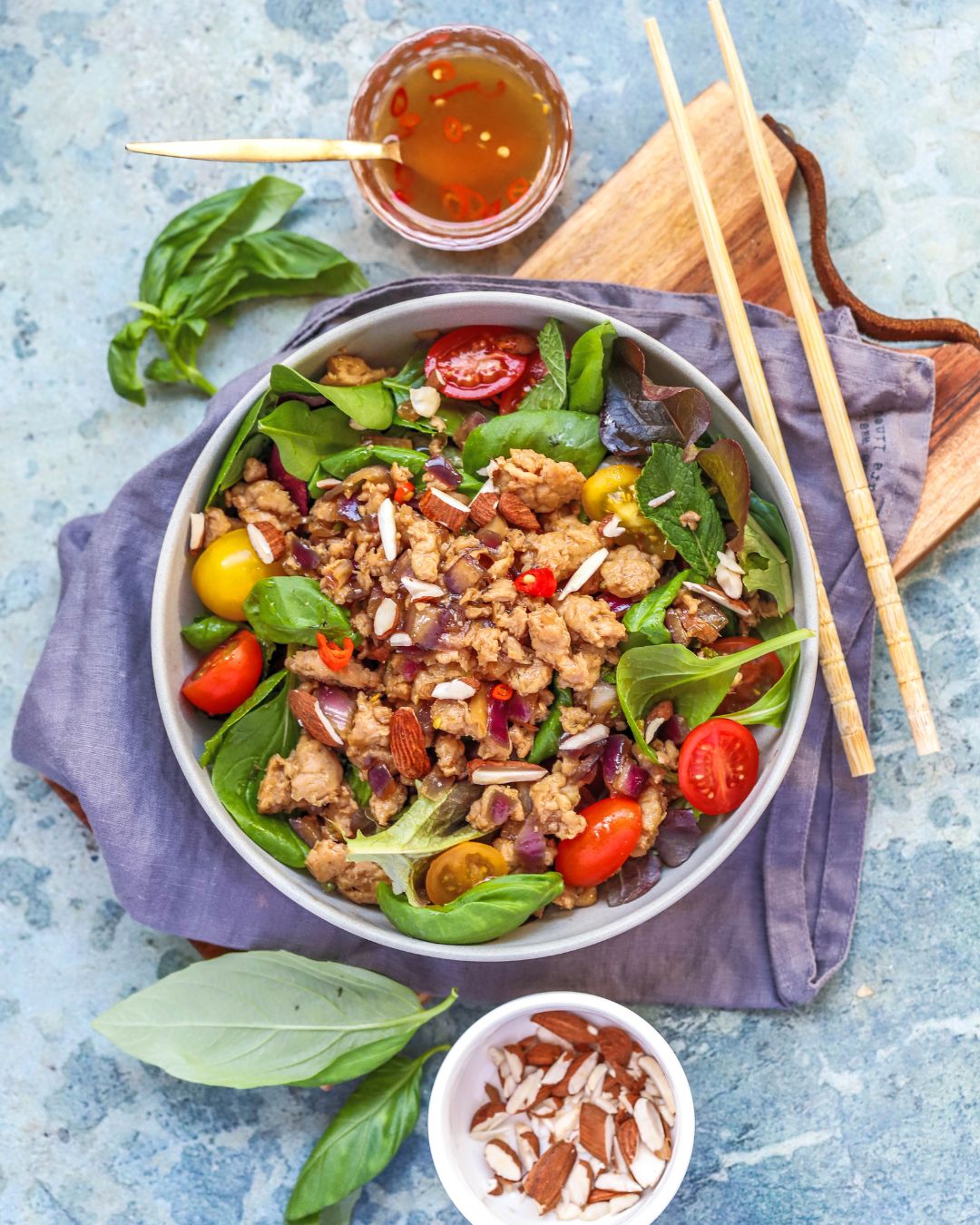 A bright, 25-minute Zesty Chicken Larb Salad with lime-fish sauce dressing, fresh herbs, and toasted almonds.